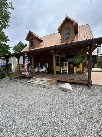 a view of a backyard with plants and a patio