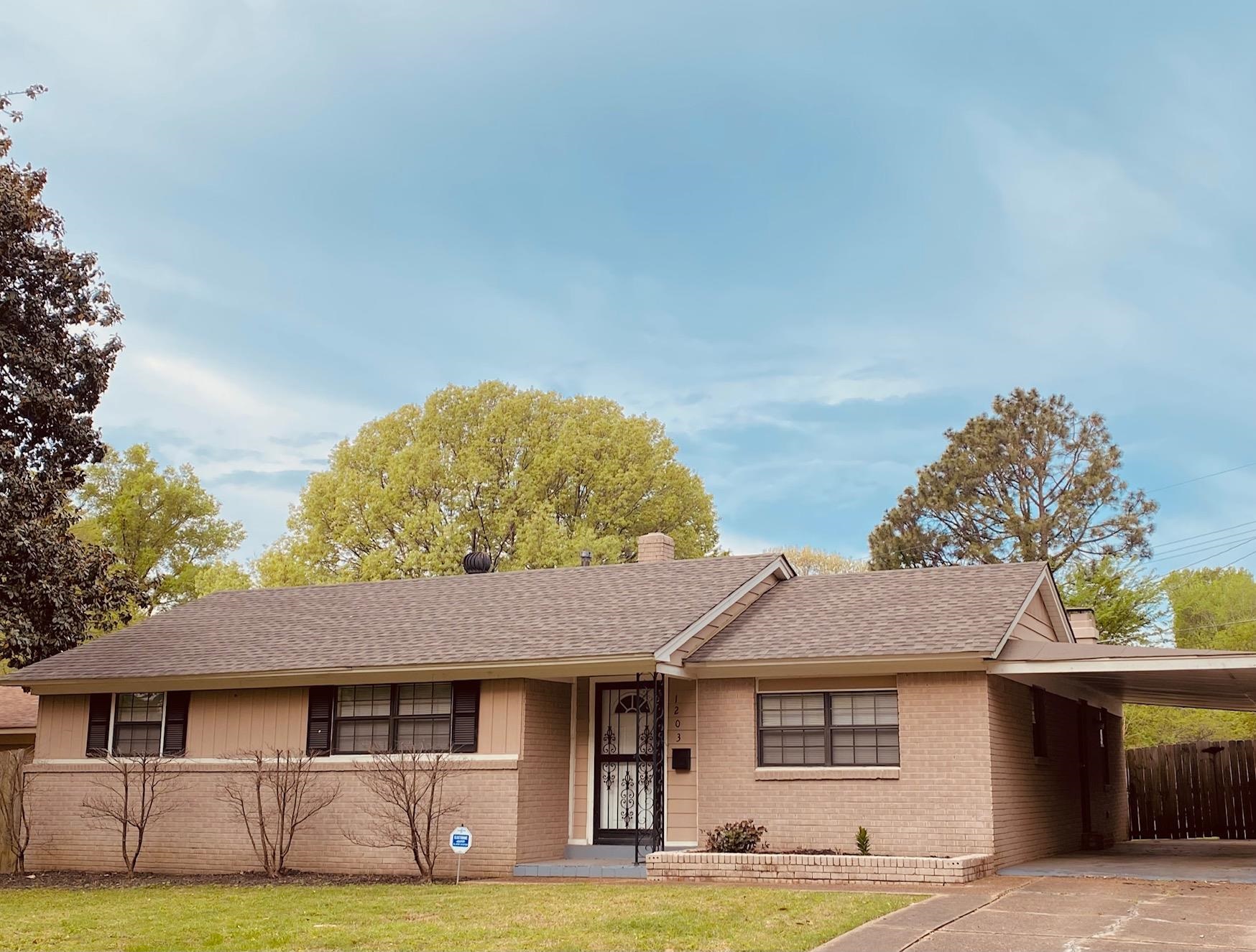 1203 Wilbec Road Memphis, TN 38117 - Photo 1 of 18 a front view of a house with garden