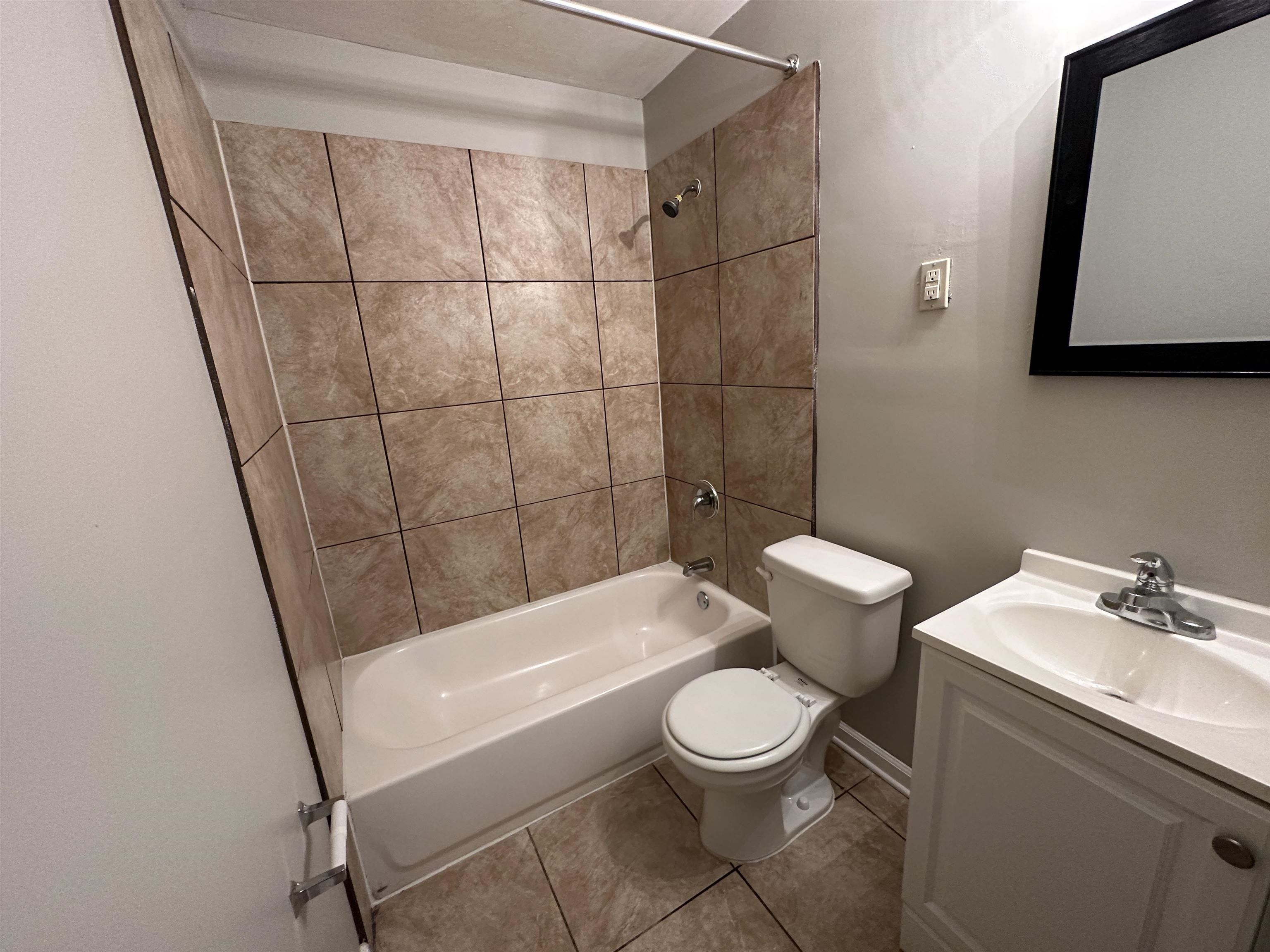 1203 Wilbec Road Memphis, TN 38117 - Photo 15 of 18 a bathroom with a toilet a sink and bathtub