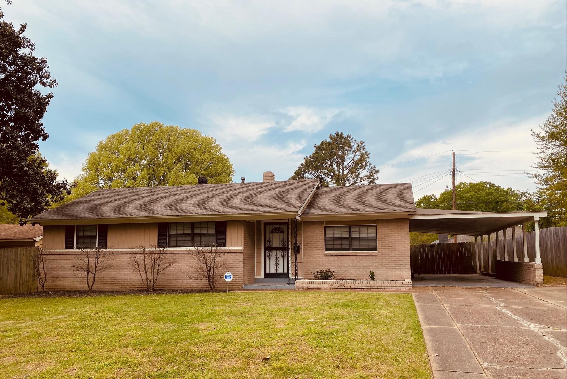 1203 Wilbec Road Memphis, TN 38117 - Photo 2 of 18 a front view of a house with a garden and yard
