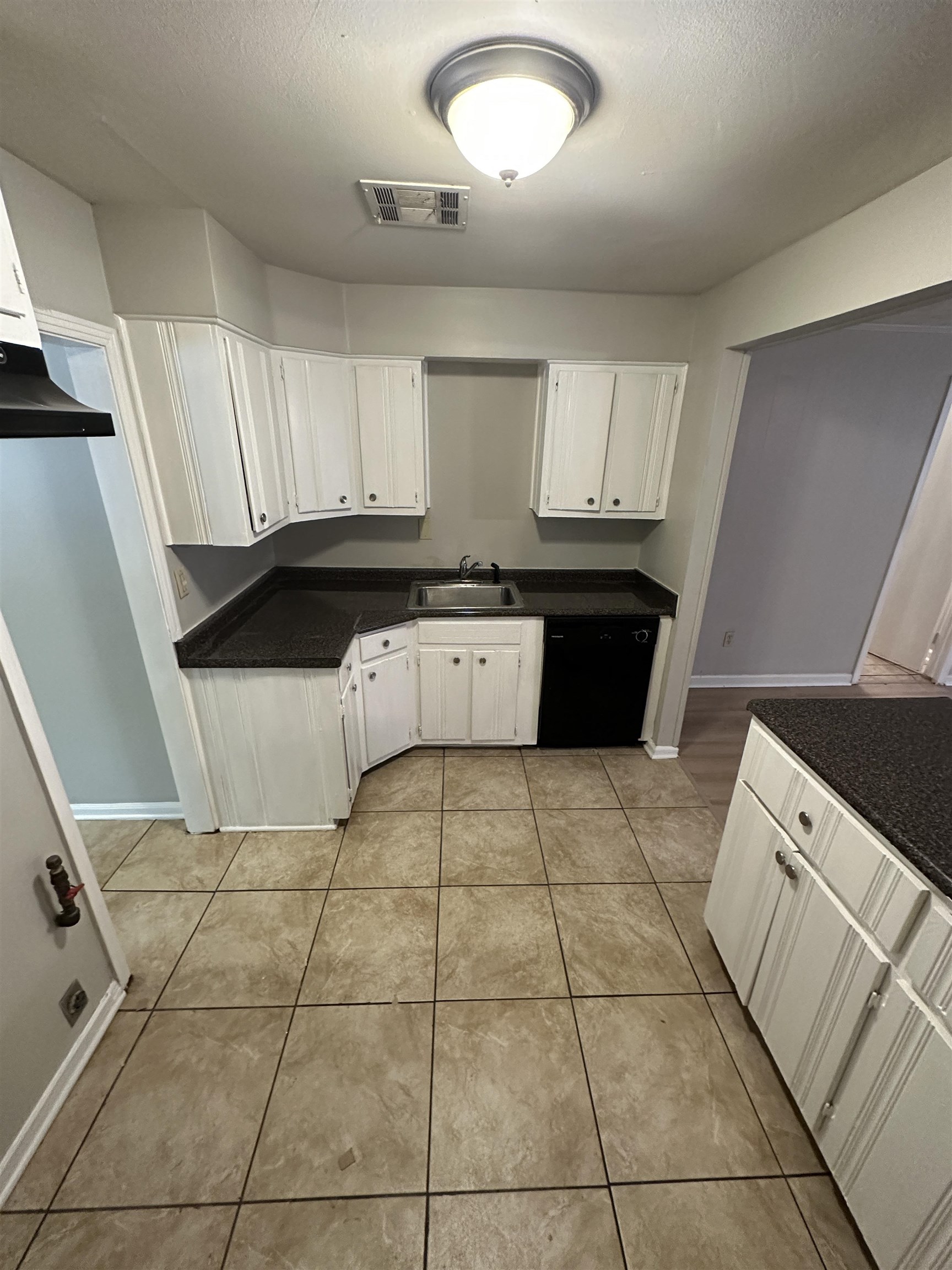 1203 Wilbec Road Memphis, TN 38117 - Photo 6 of 18 a kitchen with stainless steel appliances a sink a counter top space and cabinets