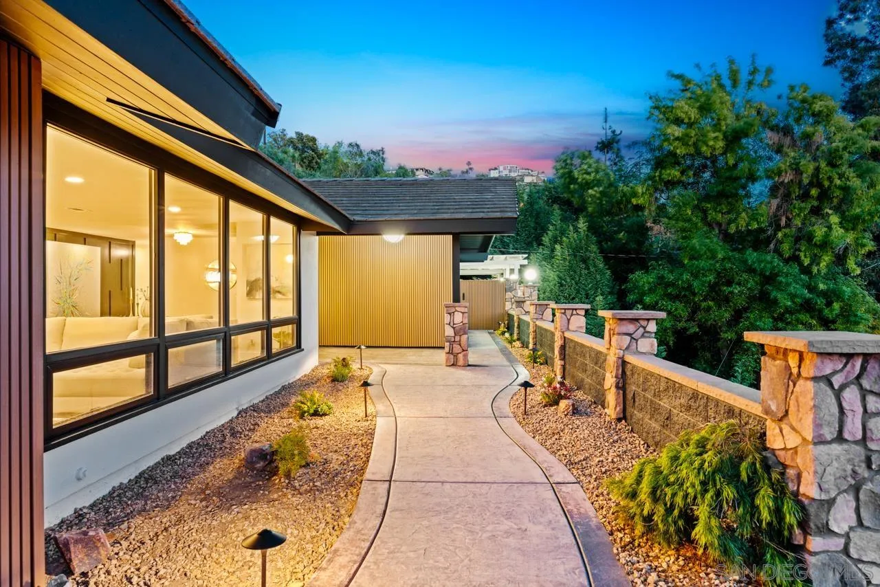 4911 Beaumont Drive La Mesa, CA 91941 - Photo 11 of 74 a view of balcony with two chairs and a large window