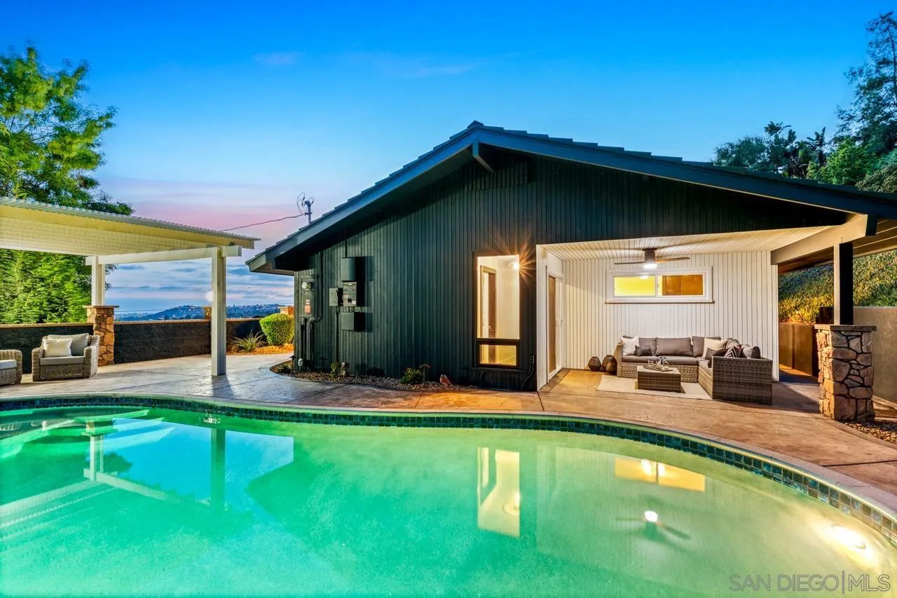 4911 Beaumont Drive La Mesa, CA 91941 - Photo 16 of 74 a swimming pool with patio outdoor seating and yard