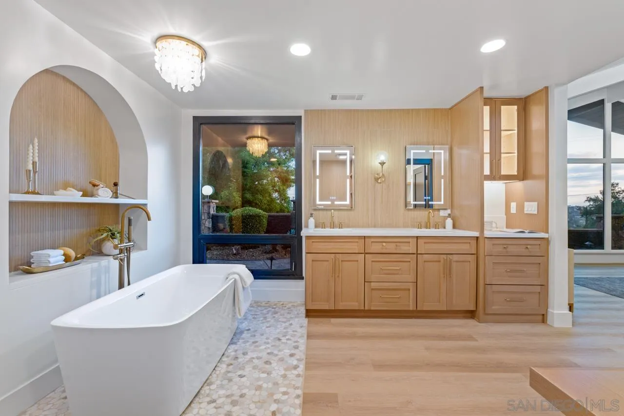 4911 Beaumont Drive La Mesa, CA 91941 - Photo 21 of 74 a large spacious bathroom with a large tub and sink