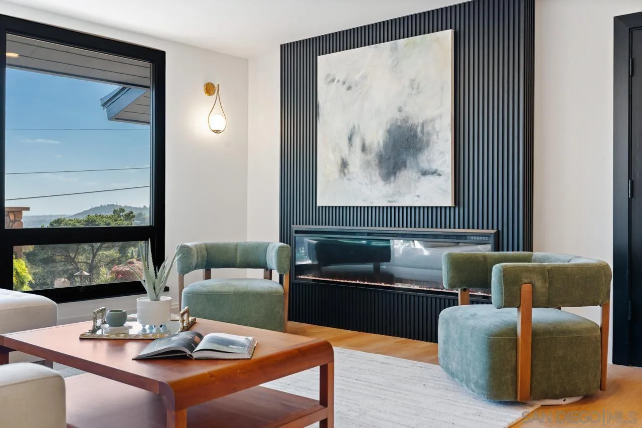 4911 Beaumont Drive La Mesa, CA 91941 - Photo 32 of 74 a living room with furniture and painting on the wall