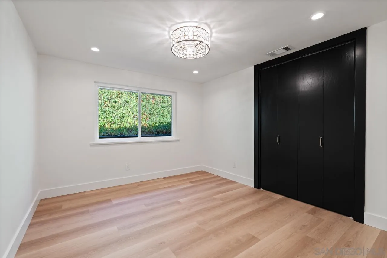 4911 Beaumont Drive La Mesa, CA 91941 - Photo 45 of 74 a view of empty room with window and ceiling fan