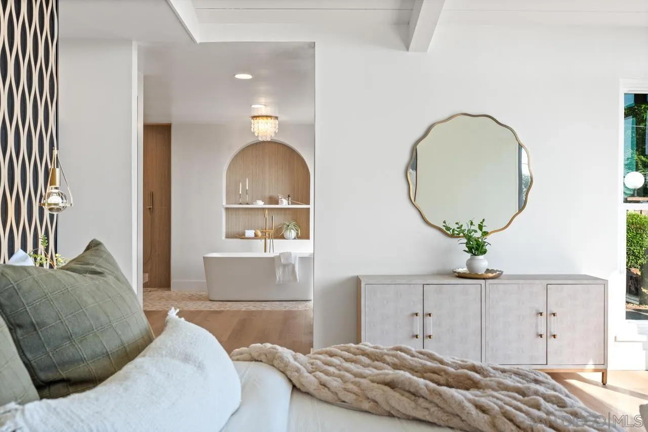 4911 Beaumont Drive La Mesa, CA 91941 - Photo 49 of 74 a bedroom with a bed a mirror and lamp