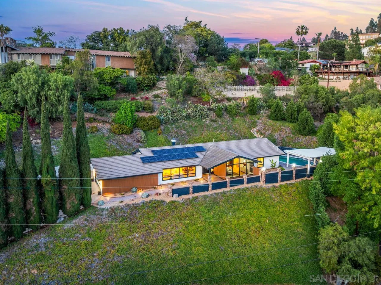 4911 Beaumont Drive La Mesa, CA 91941 - Photo 5 of 74 an aerial view of a house with swimming pool garden and outdoor seating