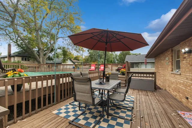a view of a roof deck with furniture