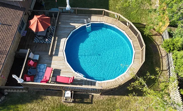 a view of swimming pool with a chairs