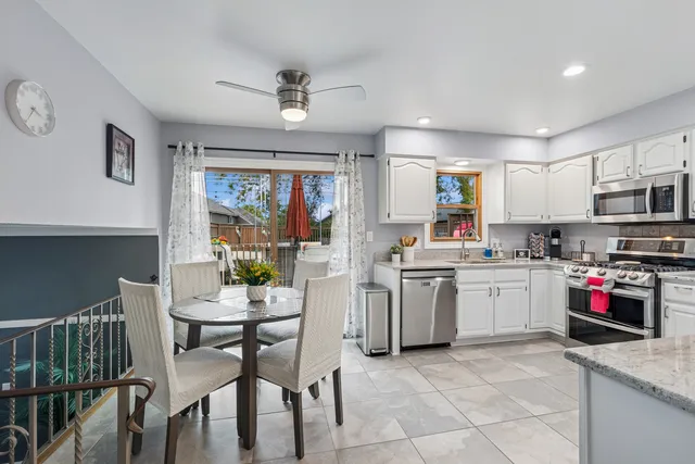 a kitchen with sink cabinets and window