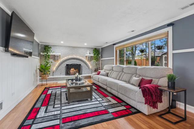 a living room with furniture and a flat screen tv