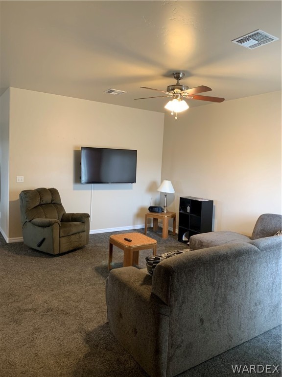 3574 North Kenneth Road Kingman, AZ 86409 - Photo 4 of 20 a living room with furniture and a flat screen tv