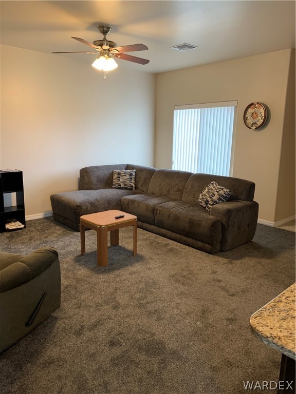3574 North Kenneth Road Kingman, AZ 86409 - Photo 6 of 20 a living room with furniture and a couch
