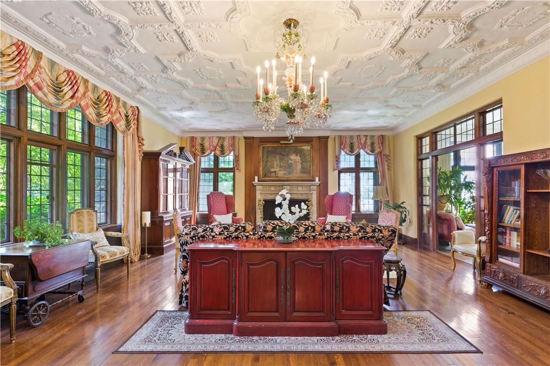 6 Shore Road Rye, NY 10580 - Photo 10 of 36 Spacious Living Room with fireplace, floor to ceiling windows and custom crafted ceiling