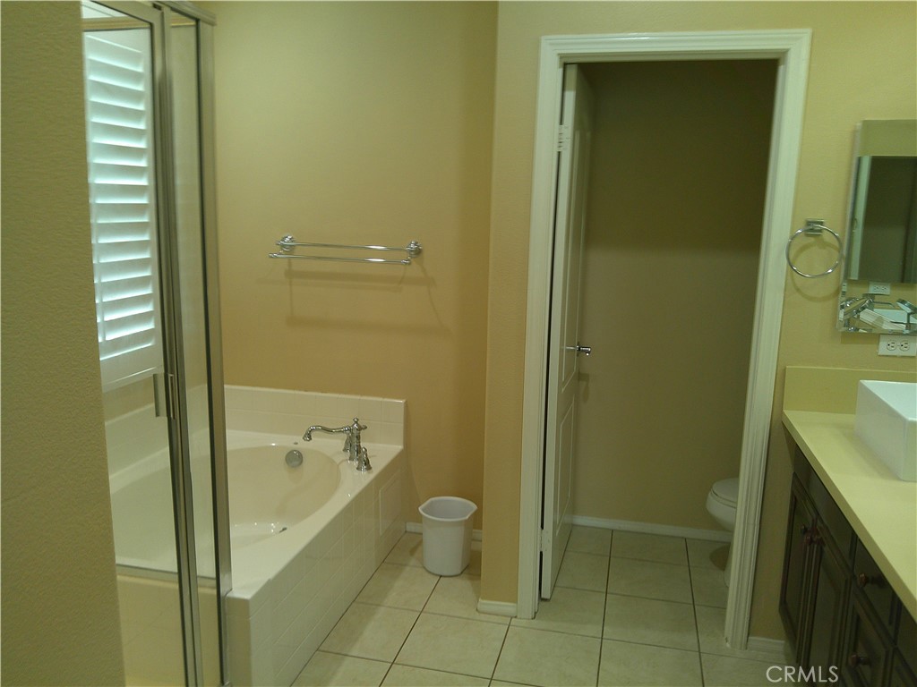 14 Durlston Way Ladera Ranch, CA 92694 - Photo 17 of 38 a bathroom with a granite countertop sink toilet and shower
