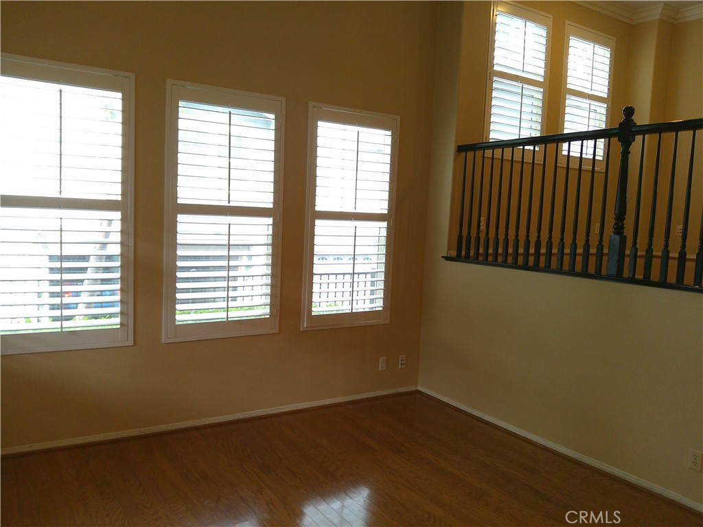 14 Durlston Way Ladera Ranch, CA 92694 - Photo 18 of 38 an empty room with wooden floor and windows