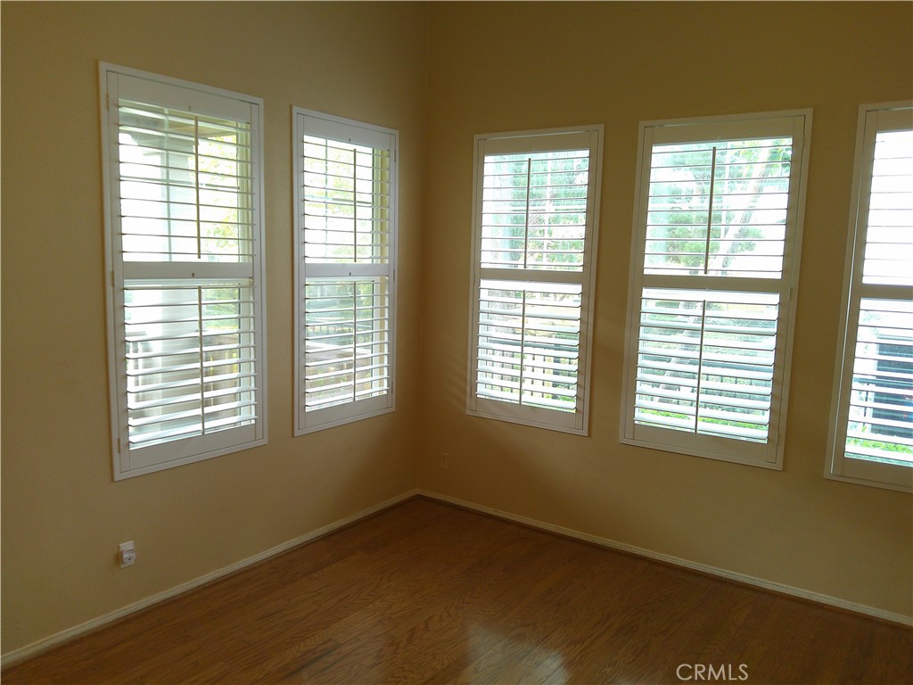 14 Durlston Way Ladera Ranch, CA 92694 - Photo 20 of 38 a view of an empty room with wooden floor and a window