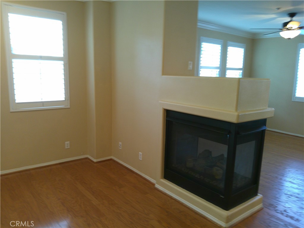 14 Durlston Way Ladera Ranch, CA 92694 - Photo 23 of 38 a room with a fireplace and a window