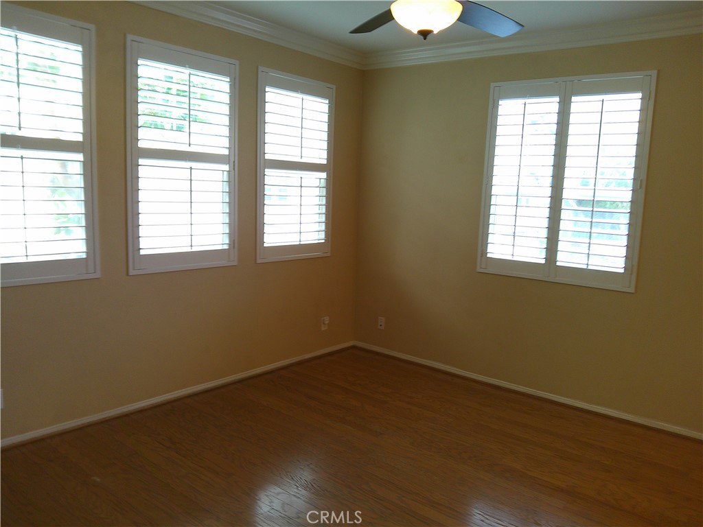 14 Durlston Way Ladera Ranch, CA 92694 - Photo 26 of 38 a view of an empty room with wooden floor and a window