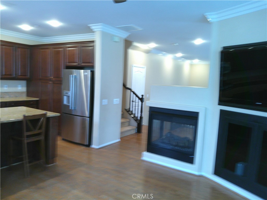 14 Durlston Way Ladera Ranch, CA 92694 - Photo 4 of 38 a kitchen with a refrigerator and a stove top oven