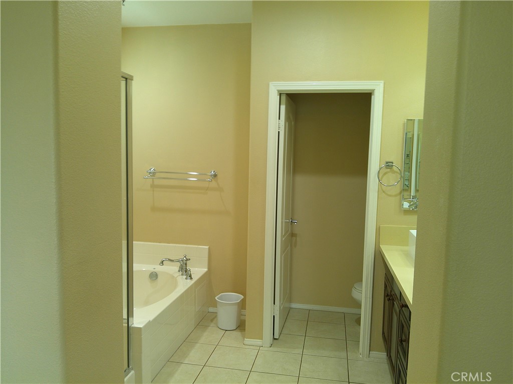 14 Durlston Way Ladera Ranch, CA 92694 - Photo 5 of 38 a bathroom with a granite countertop window and a sink