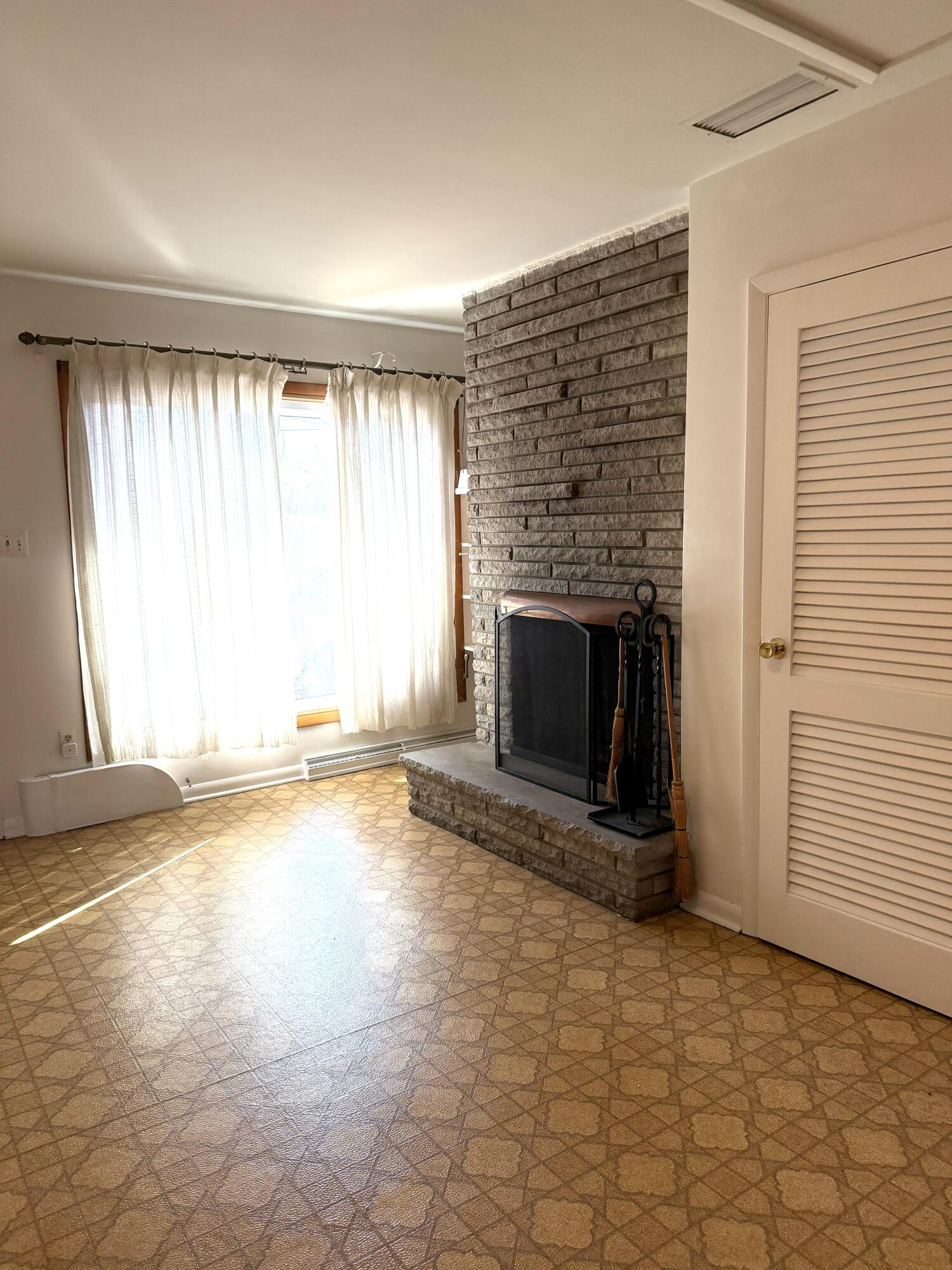 5451 Marcella Road Merrillville, IN 46410 - Photo 16 of 24 an empty room with windows and fireplace