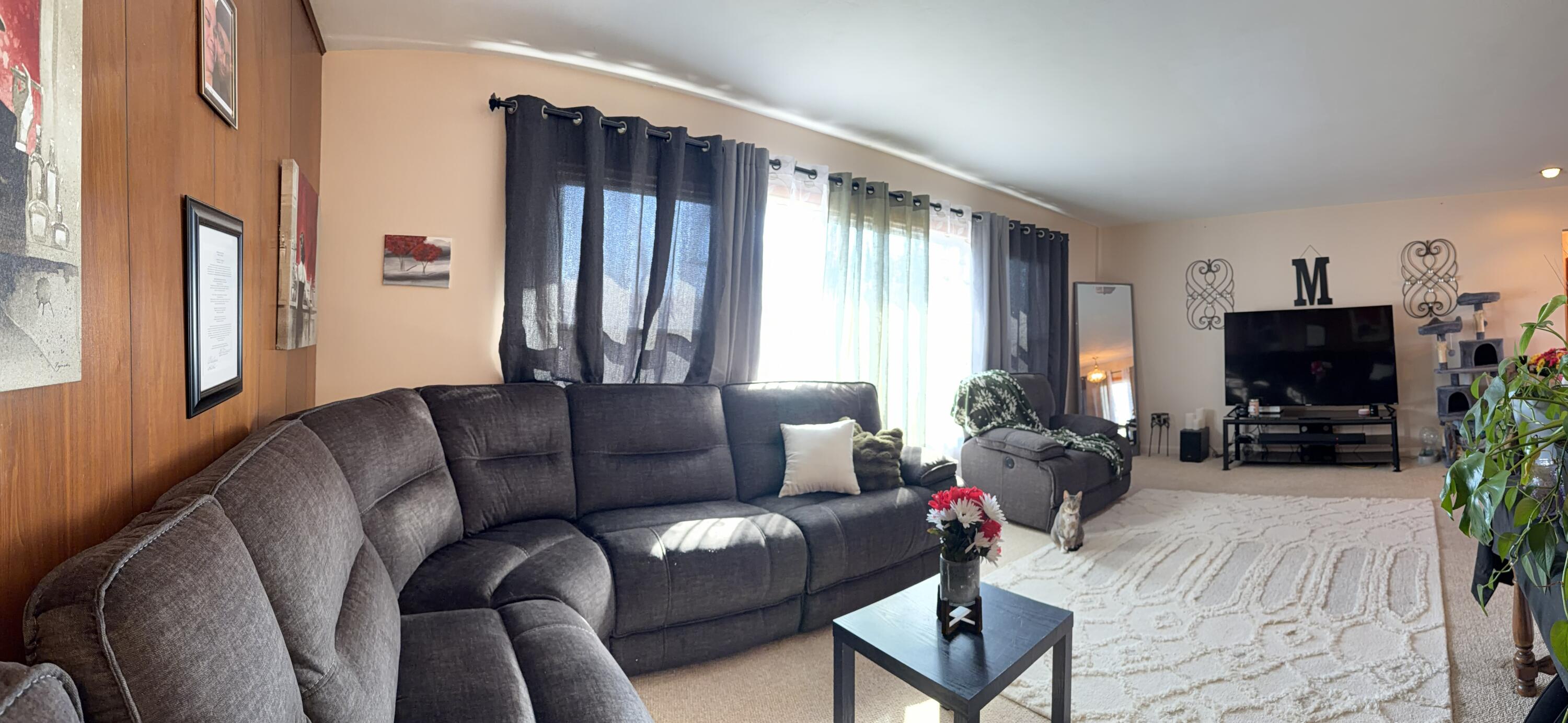 5451 Marcella Road Merrillville, IN 46410 - Photo 4 of 24 a living room with furniture and a flat screen tv