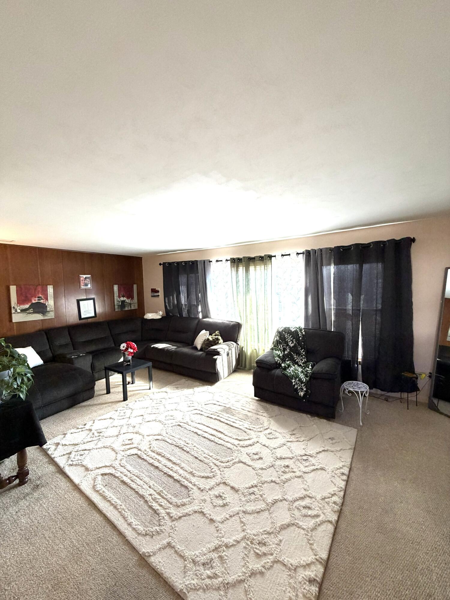 5451 Marcella Road Merrillville, IN 46410 - Photo 5 of 24 a living room with furniture a lamp and a window
