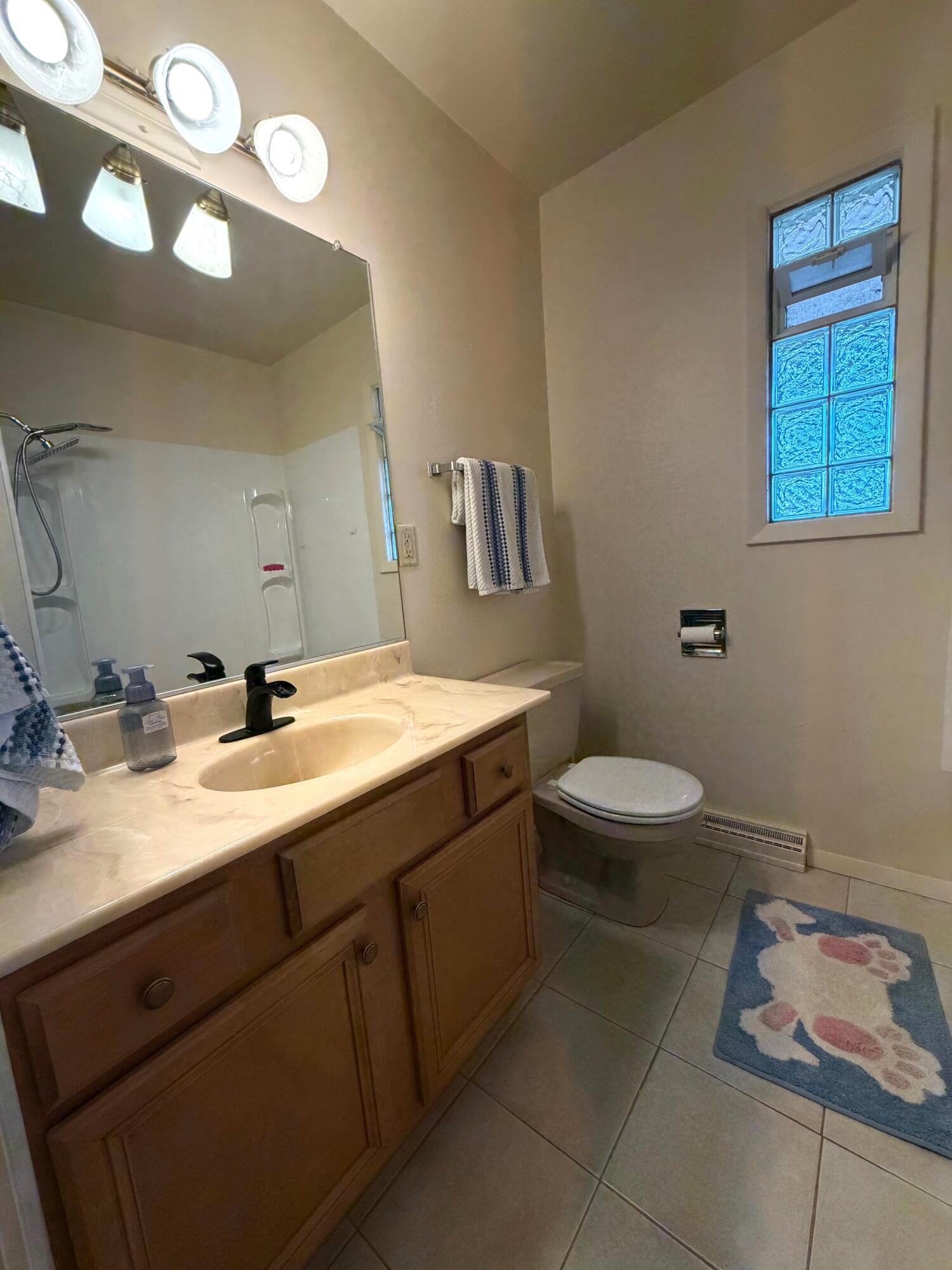 5451 Marcella Road Merrillville, IN 46410 - Photo 6 of 24 a bathroom with a double vanity sink toilet and a mirror