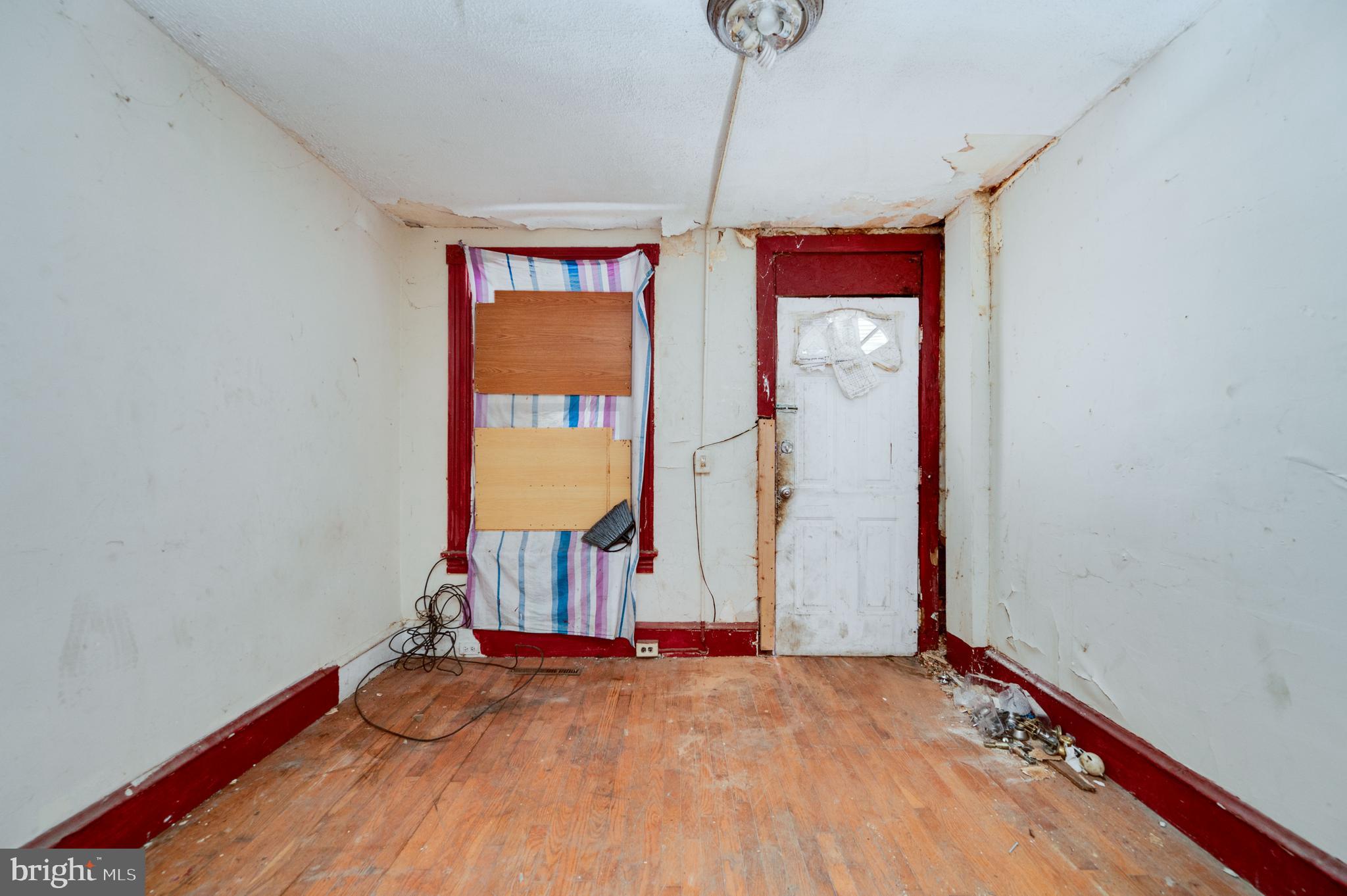 233 Hudson Street Reading, PA 19601 - Photo 2 of 27 a view of empty room with wooden floor