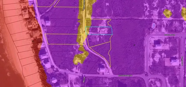 a view of a red door and wooden floor