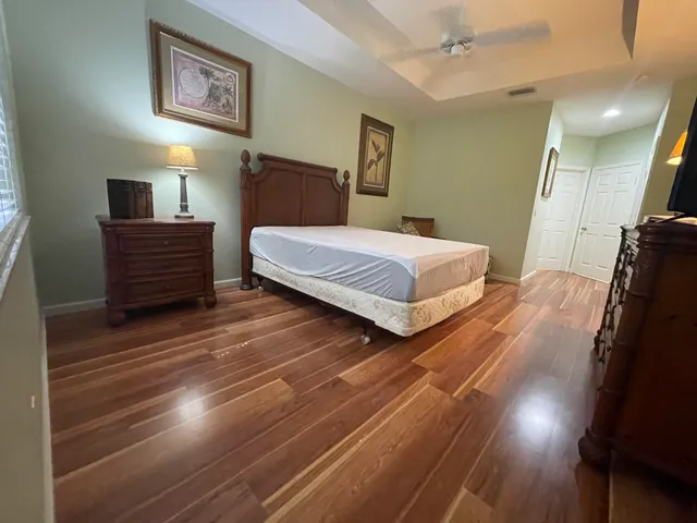 a bedroom with double bed and a walk in closet