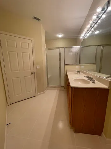 a room with a sink and a mirror