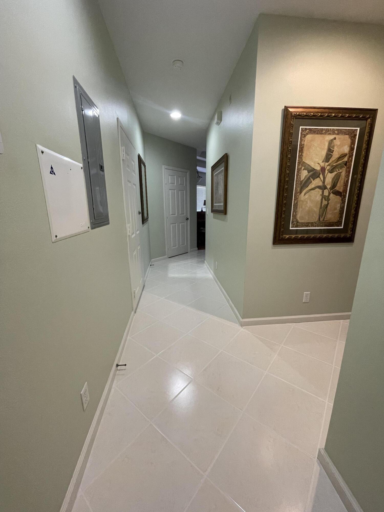 9125 Sand Shot Way, Unit A Port St. Lucie, FL 34986 - Photo 2 of 22 a view of a hallway with entryway