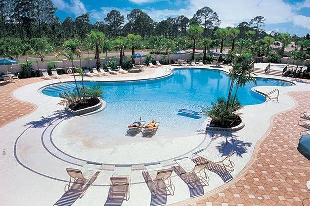 a view of a swimming pool with lounge chair