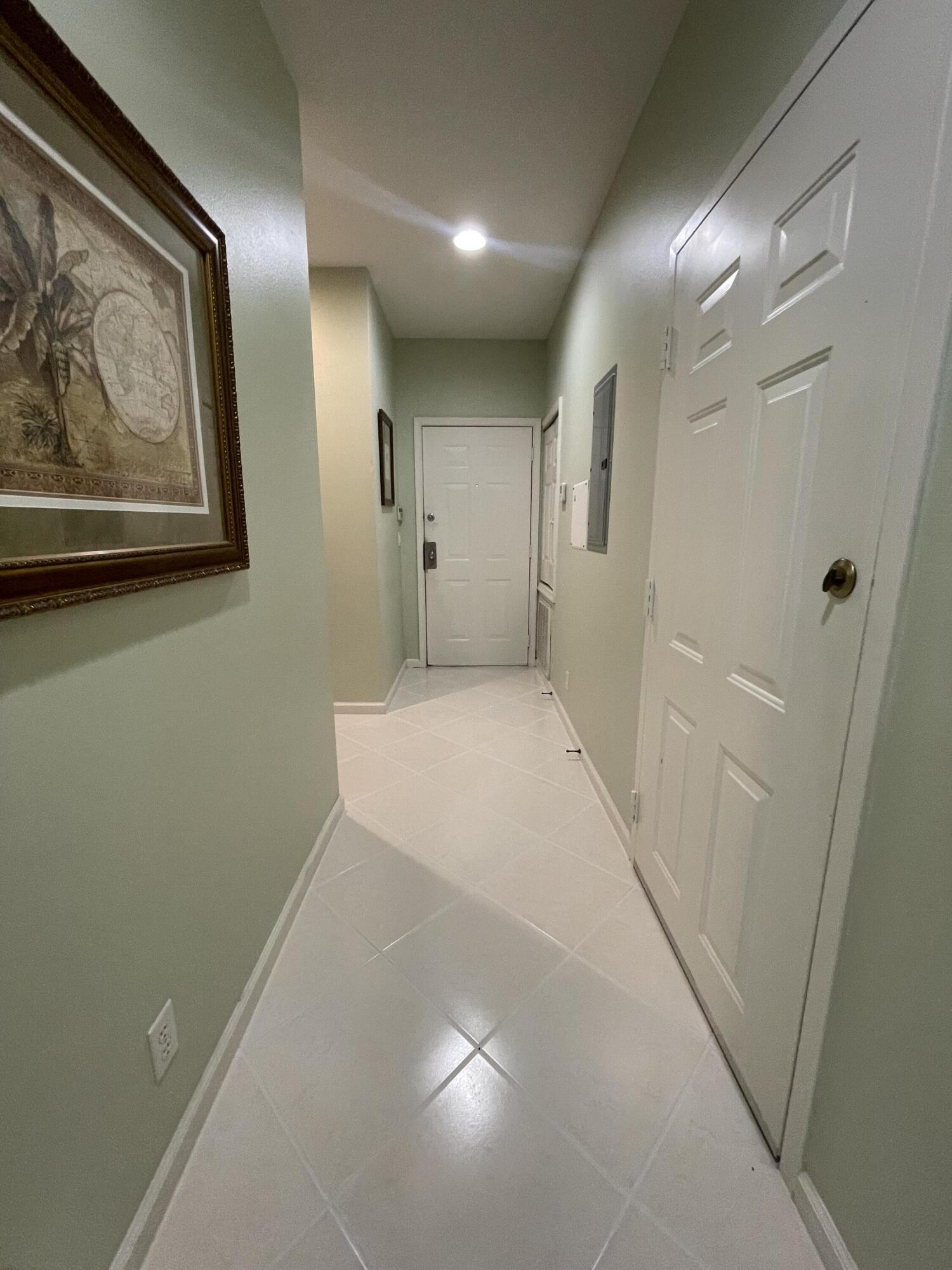 9125 Sand Shot Way, Unit A Port St. Lucie, FL 34986 - Photo 3 of 22 a view of a hallway