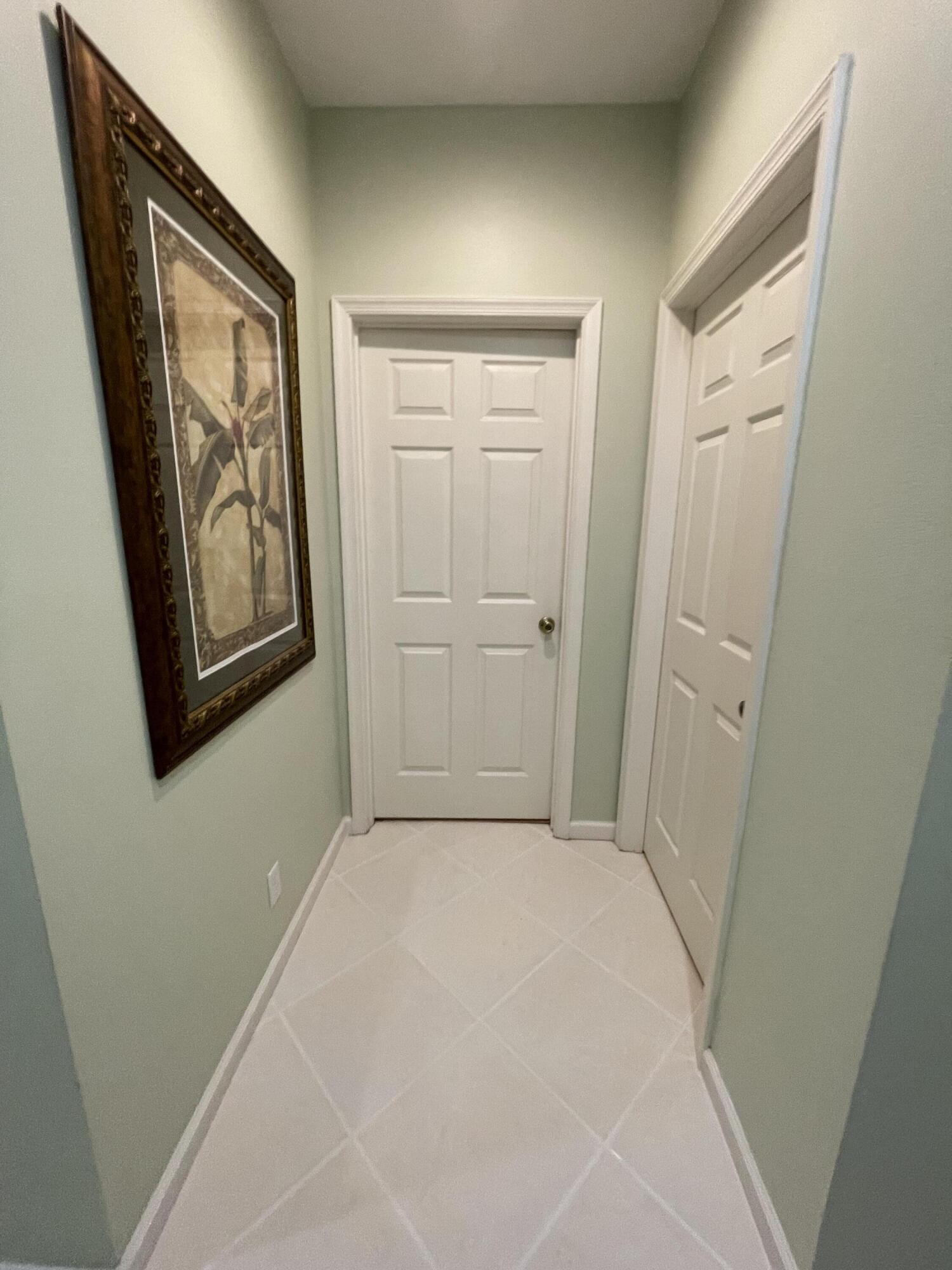 9125 Sand Shot Way, Unit A Port St. Lucie, FL 34986 - Photo 10 of 22 an empty room with windows and closet