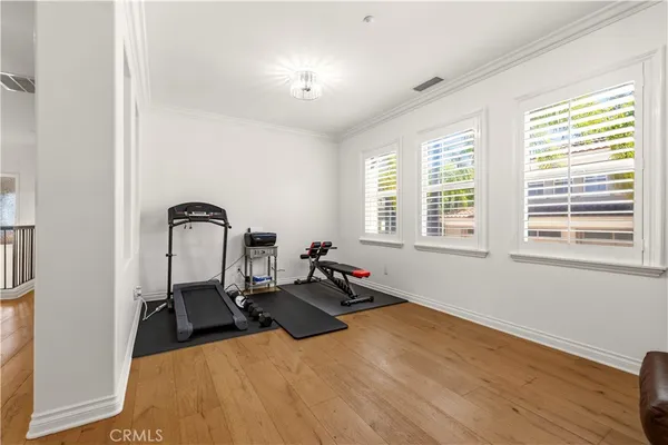 a bed room with a bed and a chair
