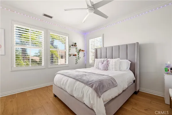 a bedroom with a bed and a book shelf