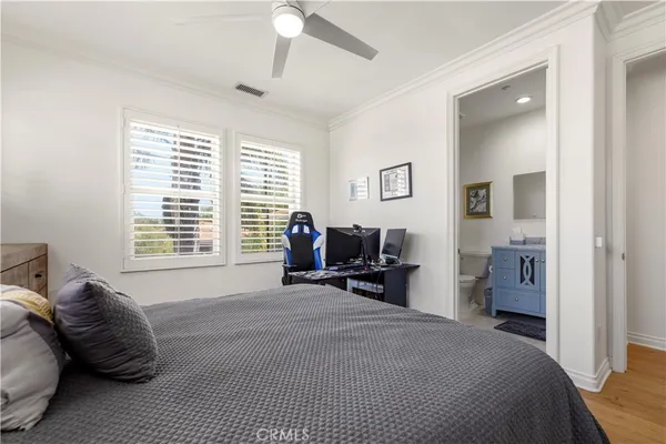 a spacious en suite bathroom with a tub sink and mirror