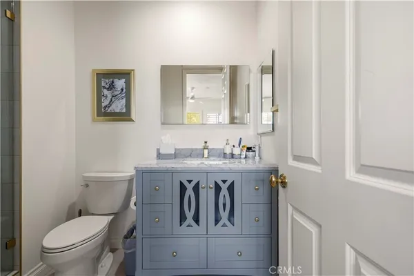 a spacious bathroom with a granite countertop sink mirror and a