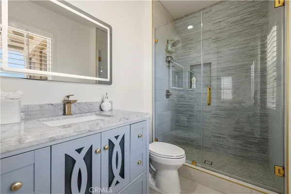 a white bath tub sitting in a spacious bathroom next to a window