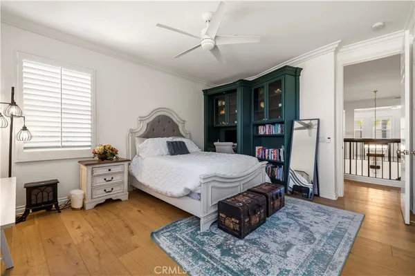 a spacious bedroom with a large bed and a fireplace