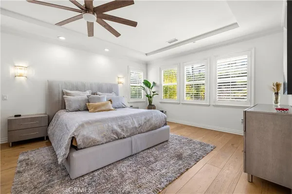 an aerial view of a house with yard swimming pool and mountain view in back