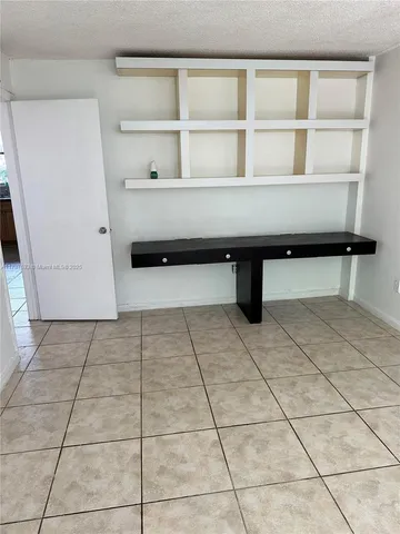 a living room with a shelf