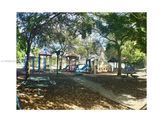 a view of a garden with a pond