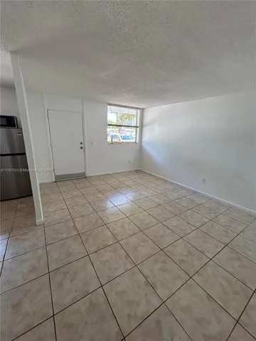 a view of an empty room with a sink