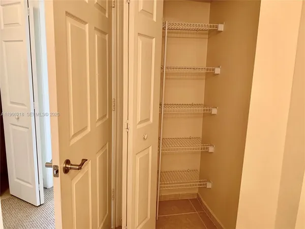 a bathroom with a glass door shower