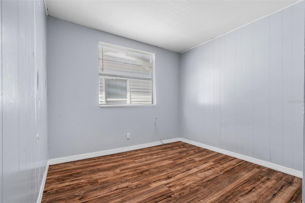 2119 West Chestnut Street Tampa, FL 33607 - Photo 18 of 33 a view of a room with wooden floor and windows